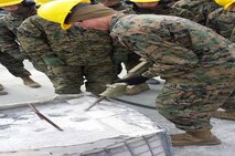 Marines of BCE 12-15 breaking up concrete.