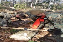 Marines of BCE 14-15 get ready to carry a log.