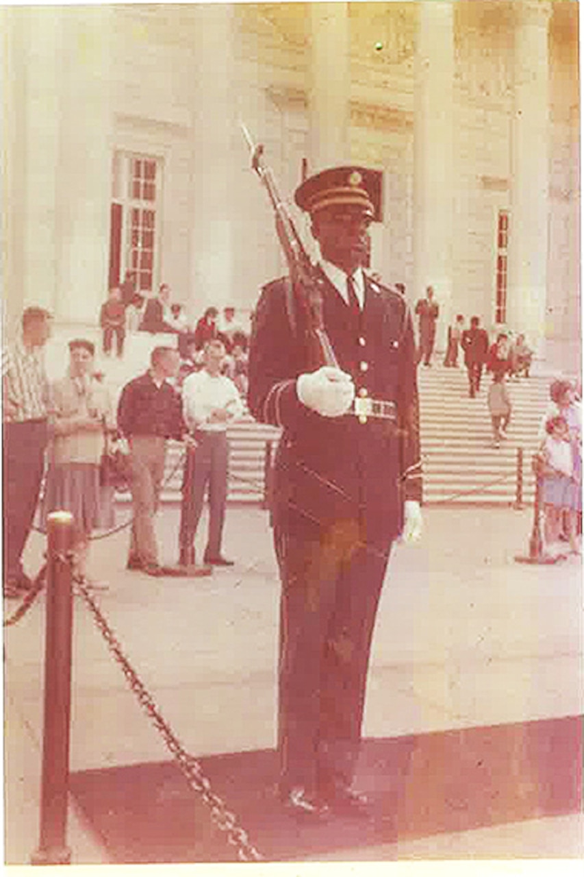 Then-Spc. 4th Class Fred Moore faces the Tomb of the Unknown Soldier at Arlington National Cemetery in Virginia during his relief walk in 1961. Moore was the first African American soldier to “walk the mat” at the Tomb. Photo courtesy of Fred Moore