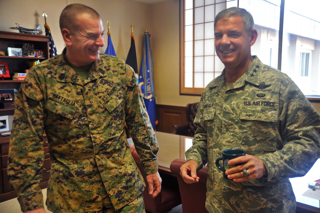 U.S. Marine Corps Sgt. Maj. Bryan Battaglia, left, senior enlisted ...