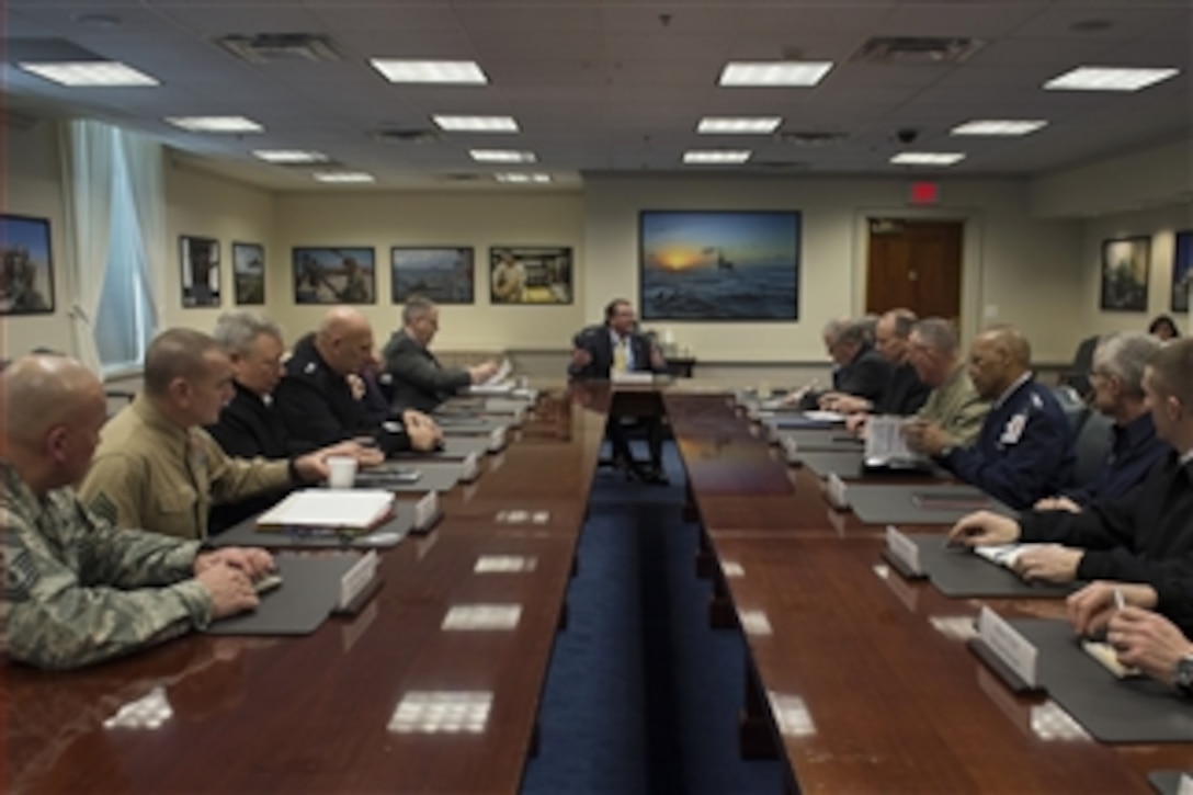Defense Secretary Ash Carter, center back, meets with senior leaders at the Pentagon, Feb. 18, 2015, as he assumed duties as the Defense Department's new leader. 