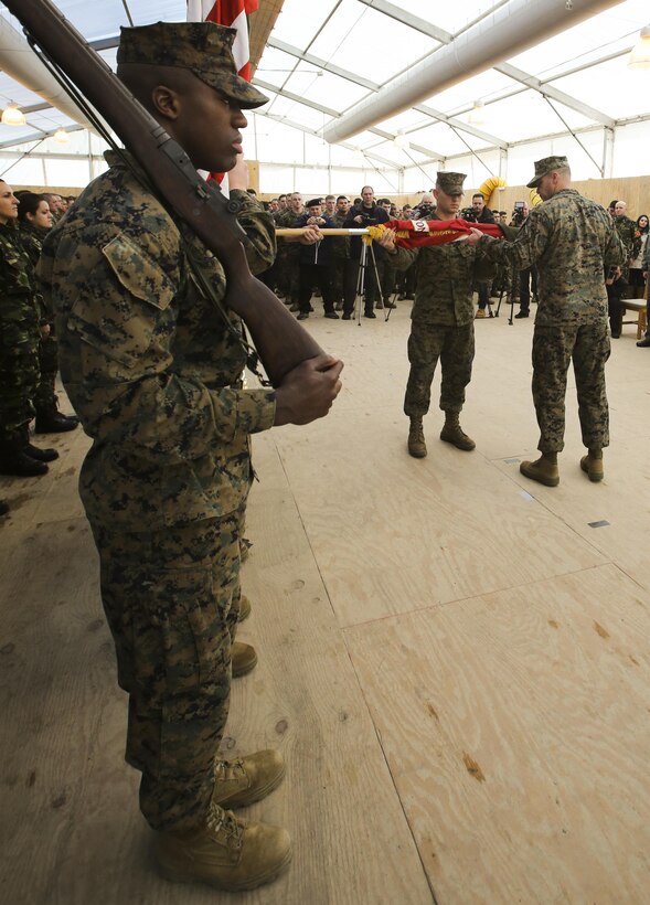 U.S. Marines with 2nd Battalion, 8th Marine Regiment uncase their unit’s colors during a transfer of authority ceremony at Mihail Kogalniceanu, Romania, Feb. 9, 2015. The ceremony marked the turnover of a new iteration of Black Sea Rotational Force, which will continue to build upon the partnerships built with other nations in the area. (U.S. Marine Corps photo by Sgt. S. T. Stewart)