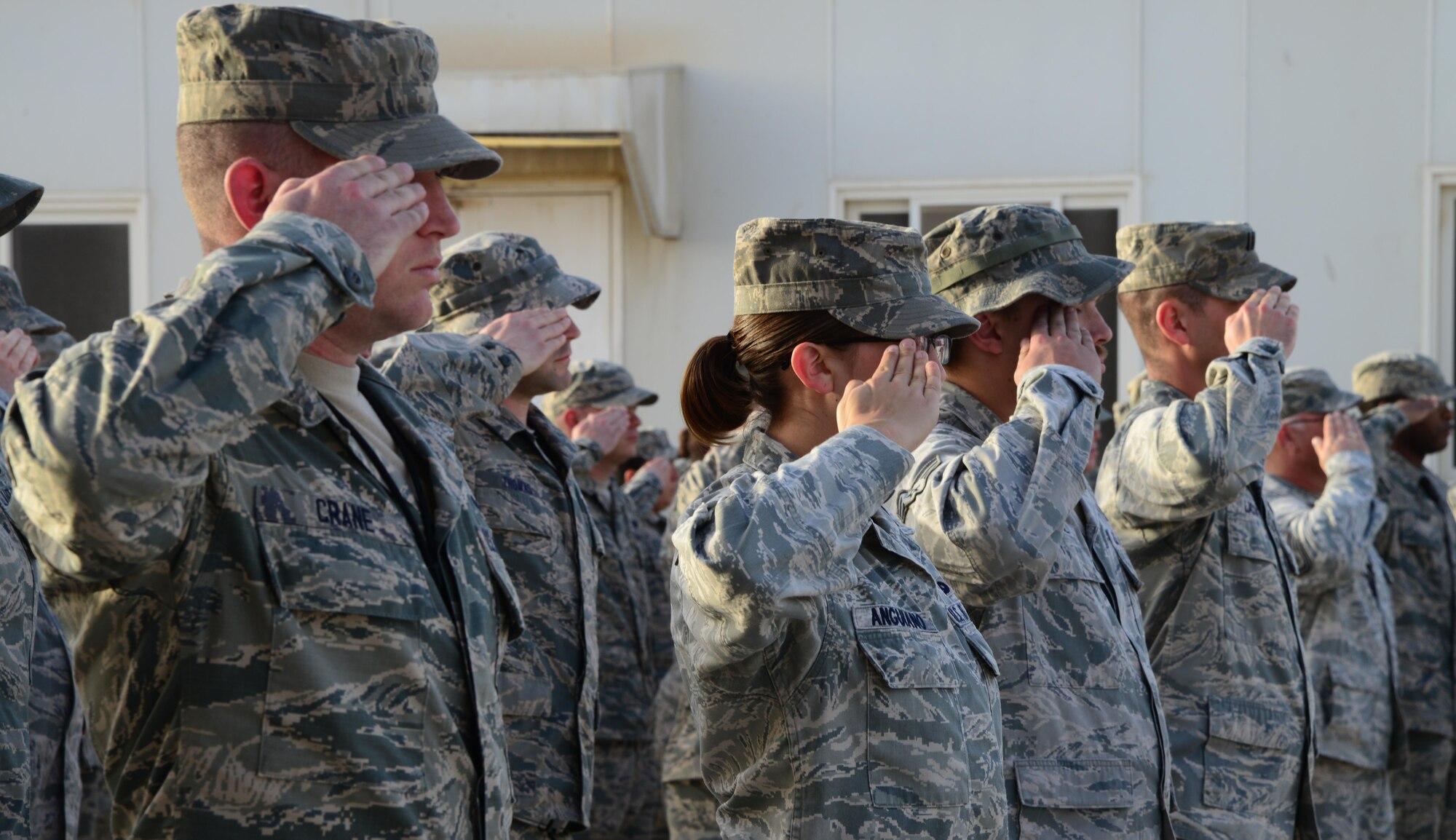 U.S. Air Force Airmen from the 379th Expeditionary Maintenance Group salute the U.S. flag while in formation during a Washington’s Birthday retreat ceremony, Feb. 16, 2015, at Al Udeid Air Base, Qatar. Washington’s Birthday, also known as President’s Day, was originally celebrated on February 22 but moved to the third Monday of February by the federal government in an attempt to create more three-day weekends.  Today, the holiday is traditionally viewed as a time of patriotic celebration and remembrance that honors presidents of United States.  (U.S. Air Force photo by Senior Airman Kia Atkins)