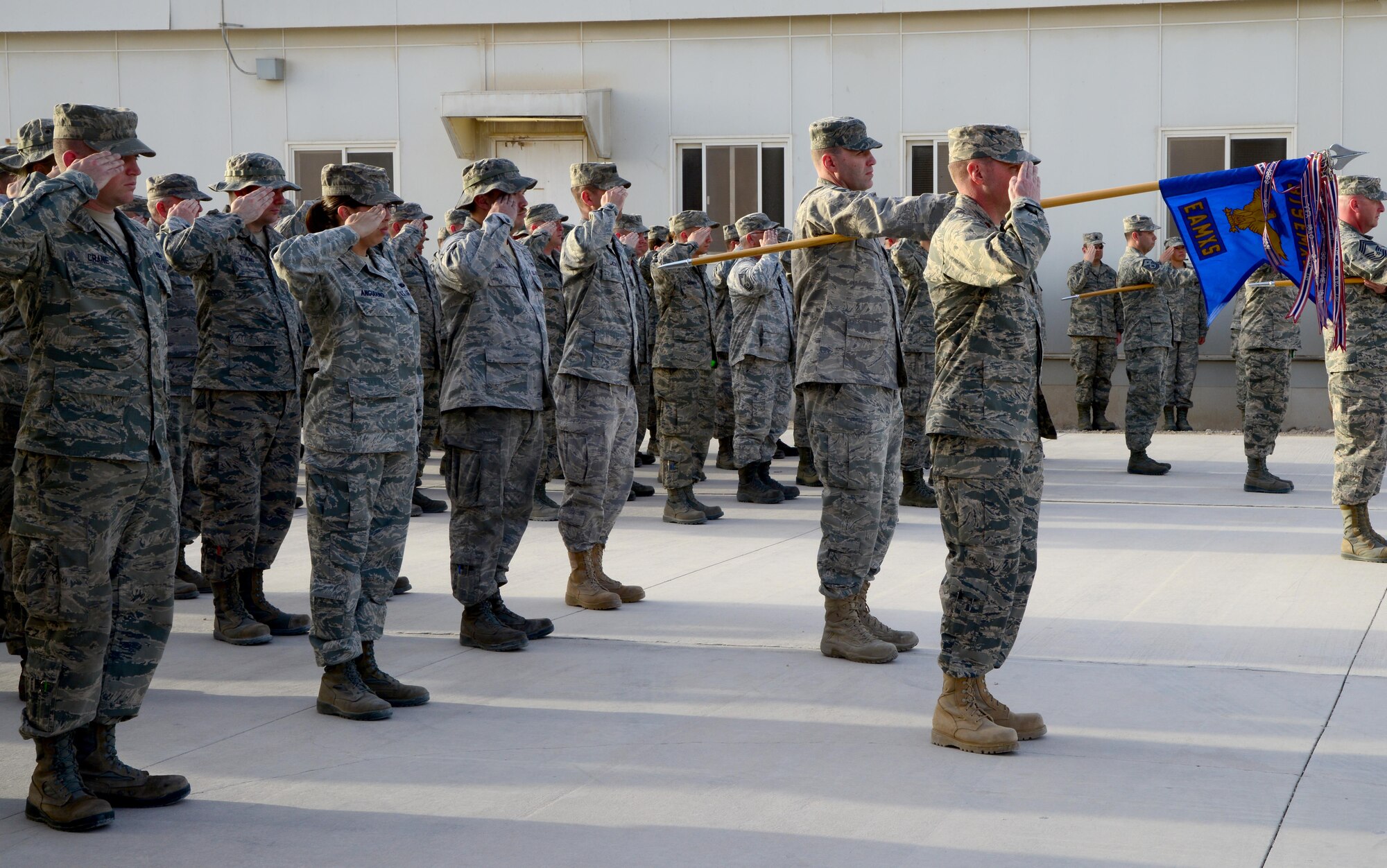 U.S. Air Force Airmen from the 379th Expeditionary Maintenance Group salute the U.S. flag while in formation during a Washington’s Birthday retreat Ceremony, Feb. 16, 2015, at Al Udeid Air Base, Qatar. Washington’s Birthday, also known as President’s Day, has been a federally recognized holiday since 1879. Contrary to popular belief, the act neither combined the birthday celebrations for Presidents George Washington and Abraham Lincoln nor actually changed the holiday’s official name to Presidents Day. (U.S. Air Force photo by Senior Airman Kia Atkins)