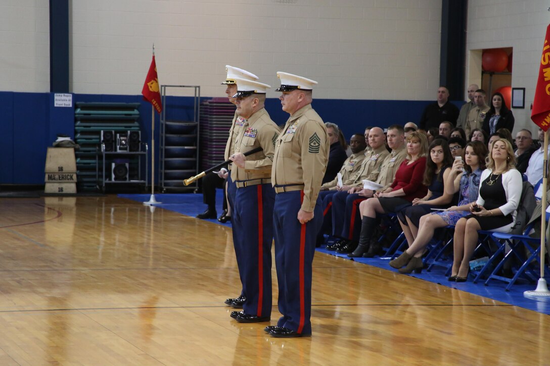 U.S Marine Corps Sgt. Maj. Joseph C. Breze, right, stands next to his replacement, Sgt. Maj. Mark F. Gonzalez, during a post and relief ceremony for the 4th Marine Corps District at the Defense Distribution Center Susquehanna Feb. 6, 2015. Col. John A. Bolt, the commanding officer of the district, presided over the ceremony. After the ceremony, Breze, a Pittsburgh, Pennsylvania native, retired from the Marine Corps having completed 30 years of service. (U.S. Marine Corps photo by Cpl. Tyler L. Birky/Released)