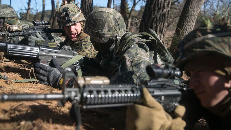Republic of Korea and U.S. Marines defend their position during Korean Marine Exchange Program 15-17 Feb. 13 at the Cham Sae Mi Close-Quarters Battle Training Facility in Pohang, Republic of Korea. The overarching goal of KMEP is to enhance and improve the interoperability of ROK and U.S. Marine Corps forces. The ROK Marines are with Company 5, 32nd Battalion, 1st ROK Marine Division. The U.S. Marines are with Company I, 3rd Battalion, 3rd Marine Regiment, currently assigned to 4th Marine Regiment, 3rd Marine Division, III Marine Expeditionary Force under the unit deployment program. 