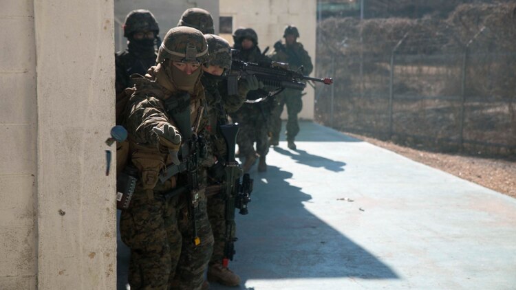 U.S. Marine Lance Cpl. Danny E. McClure, from Decatur, Illinois, throws an M69 training grenade during Korean Marine Exchange Program 15-17 Feb. 9 at the Cham Sae Mi Close-Quarters Training Facility in Pohang, Republic of Korea. The overarching goal of KMEP is to enhance and improve the interoperability of ROK and U.S. Marine Corps forces. McClure is a rifleman with Company I, 3rd Battalion, 3rd Marine Regiment, currently assigned to 4th Marine Regiment, 3rd Marine Division, III Marine Expeditionary Force under the unit deployment program. 