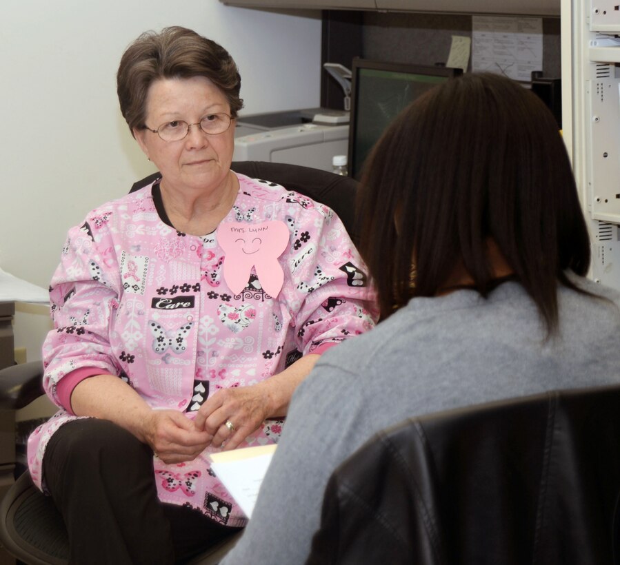 Lynn McDonald, registered dental hygienist, Naval Branch Health Clinic, Albany, talks about how she became a hygienist as well as what qualifications and education are needed to become one with a Dougherty County high school student. More than 20 Dougherty County high school students conducted job shadowing for careers they are interested in aboard Marine Corps Logistics Base Albany, Feb. 18.