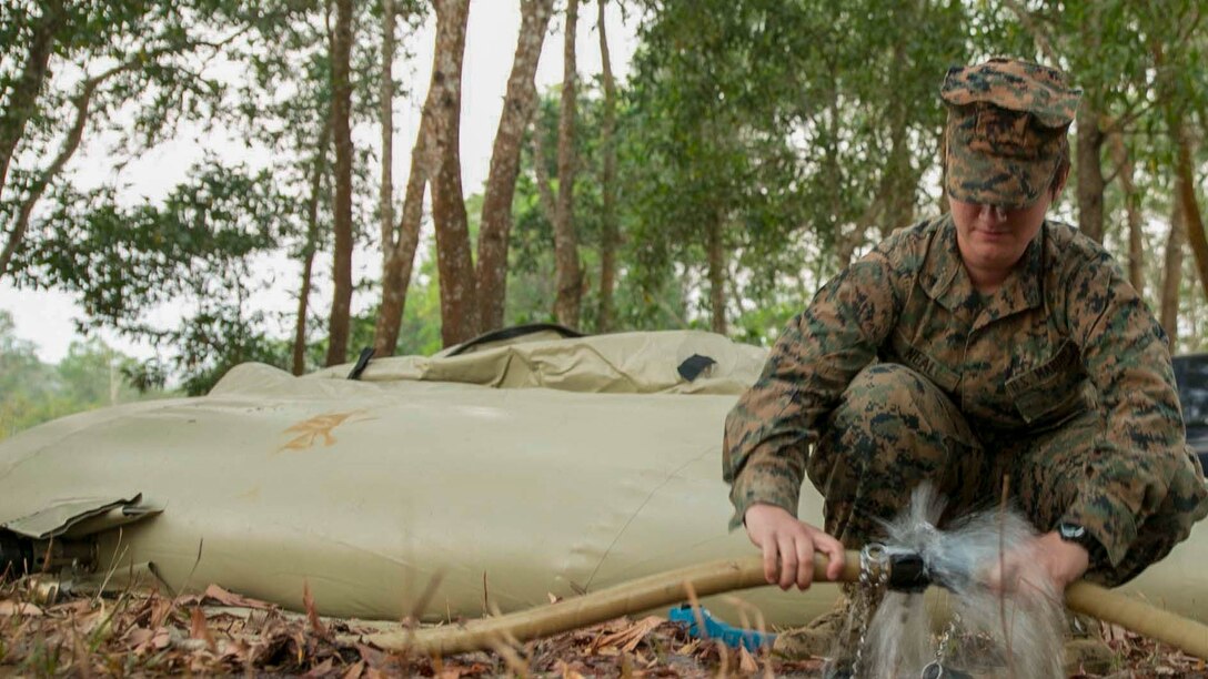 Lance Cpl. Jamie Neal, from Houma, Louisiana, purifies pond water Feb. 11 during exercise Cobra Gold 2015 at Ban Chan Krem, Thailand. The U.S. Marines utilized the Light Weight Water Purification System to supply the Royal Thai Marines and the ranges with clean water. Neal is a water support technician with Combat Logistics Battalion 4, 3rd Marine Logistics Group, III Marine Expeditionary Force.