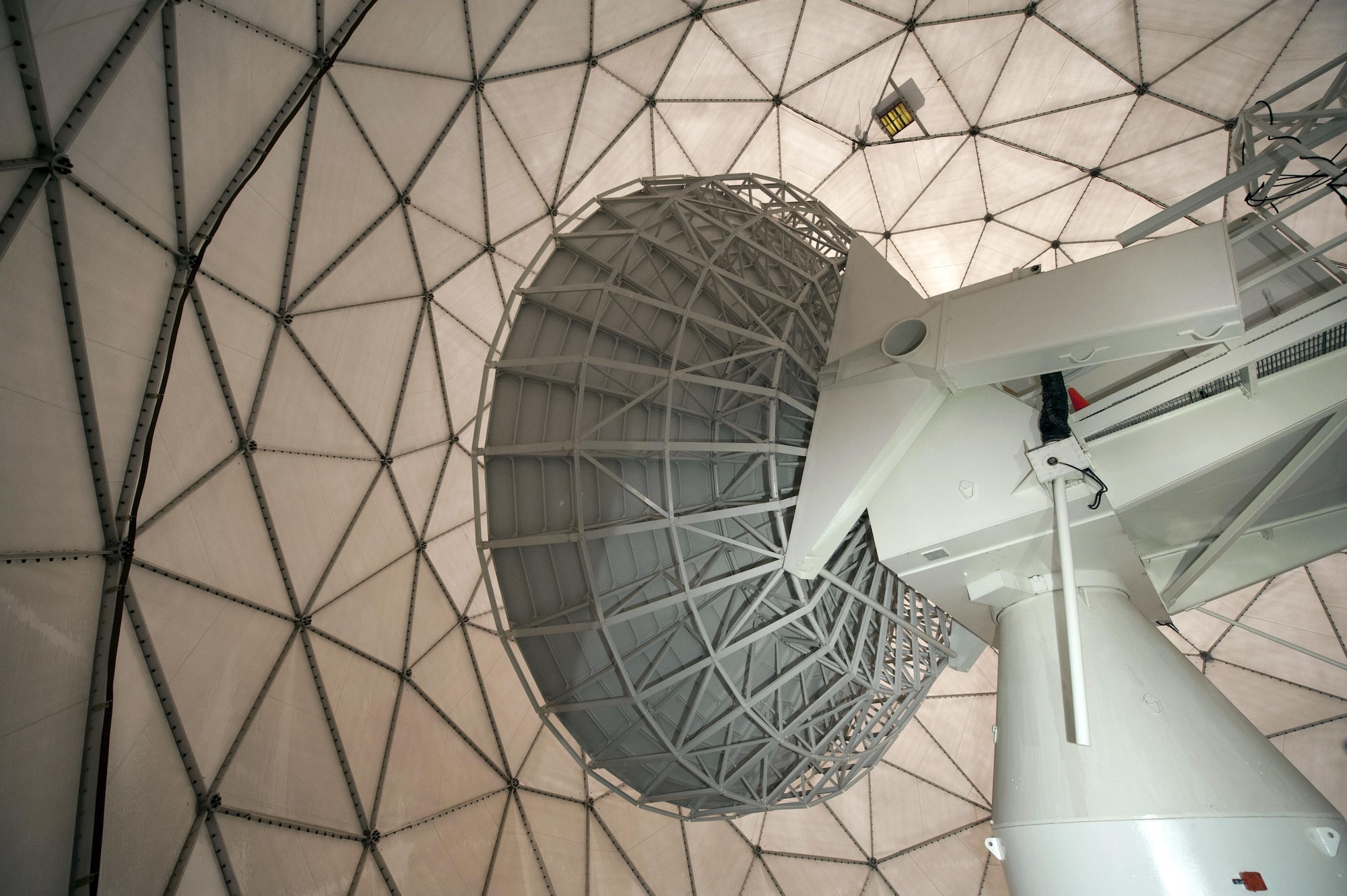 The radomes, lightly referred to as “golf balls,” on Buckley Air Force Base, Colo., house and protect satellite dishes and other crucial space operations equipment. The purpose of the giant spheres is to protect the equipment from the weather. (U.S. Air Force photo/Airman 1st Class Emily E. Amyotte)
