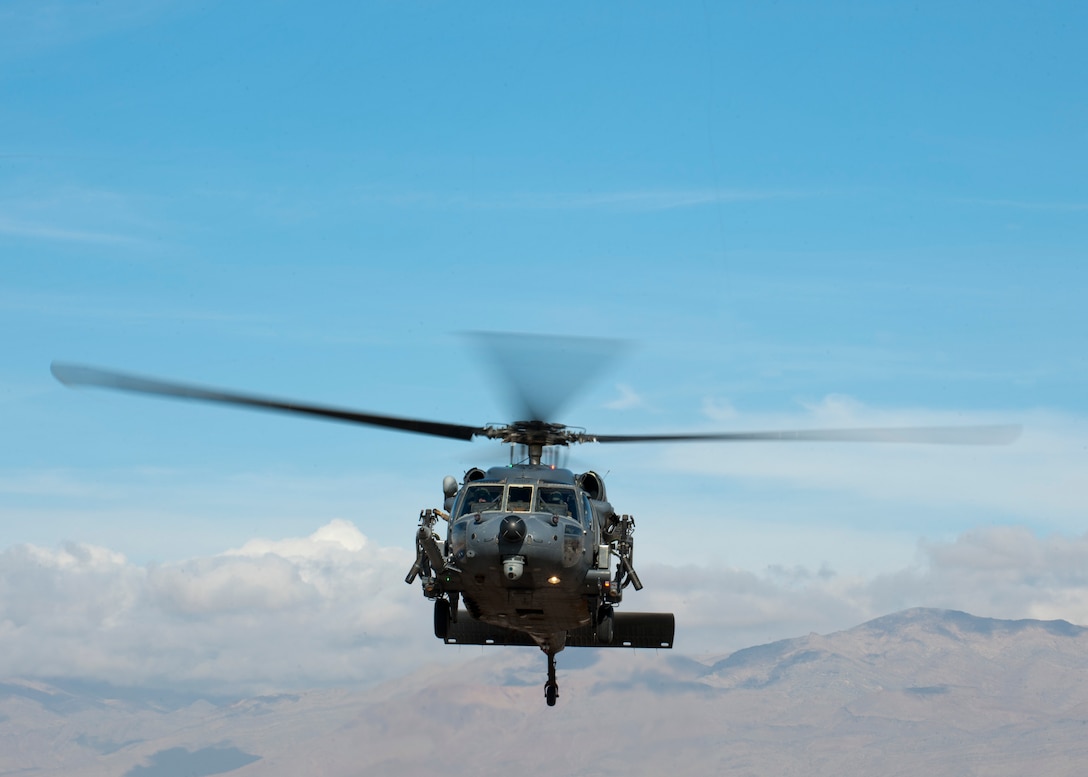 An HH-60G Pave Hawk assigned to the 66th Rescue Squadron takes off for a training exercise Jan. 12, 2015, at Nellis Air Force Base, Nev. The 823rd Maintenance Squadron is responsible for maintaining the aircraft and ensuring they are mission ready for the 66th and 58th Rescue Squadrons to carry out their combat search and rescue operations. (U.S. Air Force photo/Senior Airman Thomas Spangler)