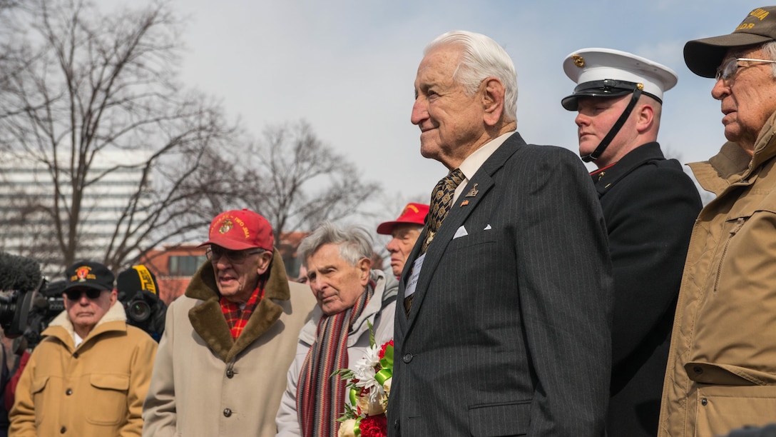 Lt. Gen. Lawrence F. Snowden, 93-year-old Iwo Jima veteran, pays tribute during the Iwo Jima Wreath Laying Ceremony at the Marine Corps War Memorial in Arlington, Va. on Feb. 19, 2015. Snowden was a 23-year-old captian during the battle