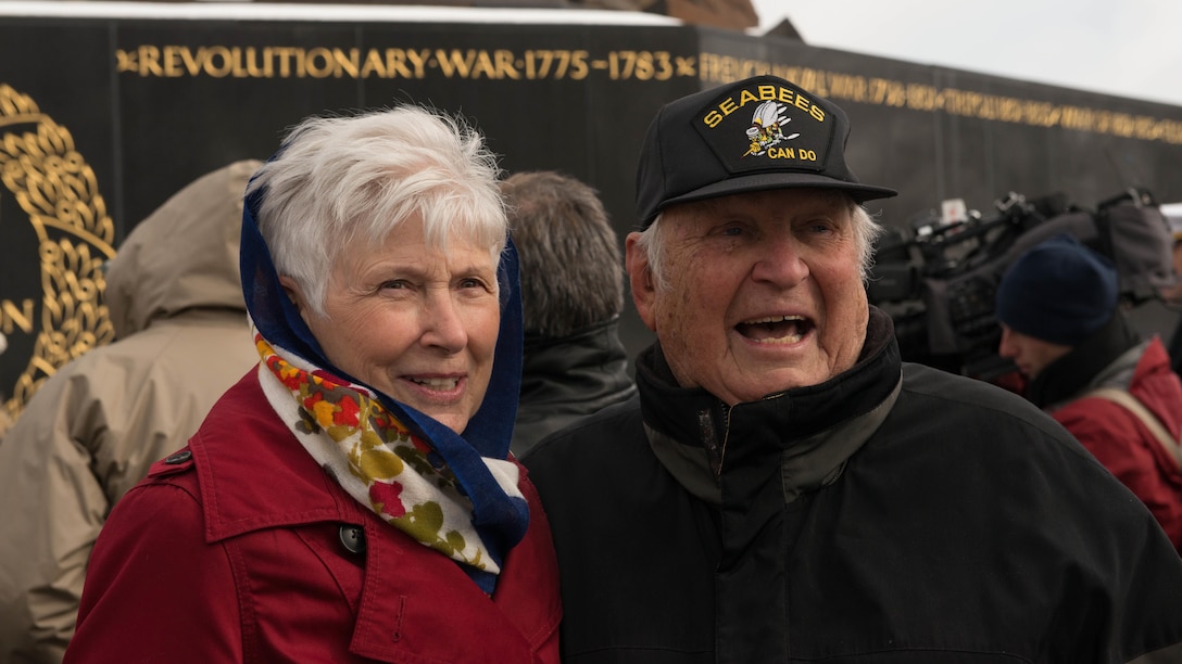 Battle of Iwo Jima veteran and wife speak with each other after the Iwo Jima Wreath Laying Ceremony at the Marine Corps War Memorial in Arlington, Va. on Feb. 19, 2015. The wreath laying recognized the 70th anniversary of the battle and the veterans' sacrifice.