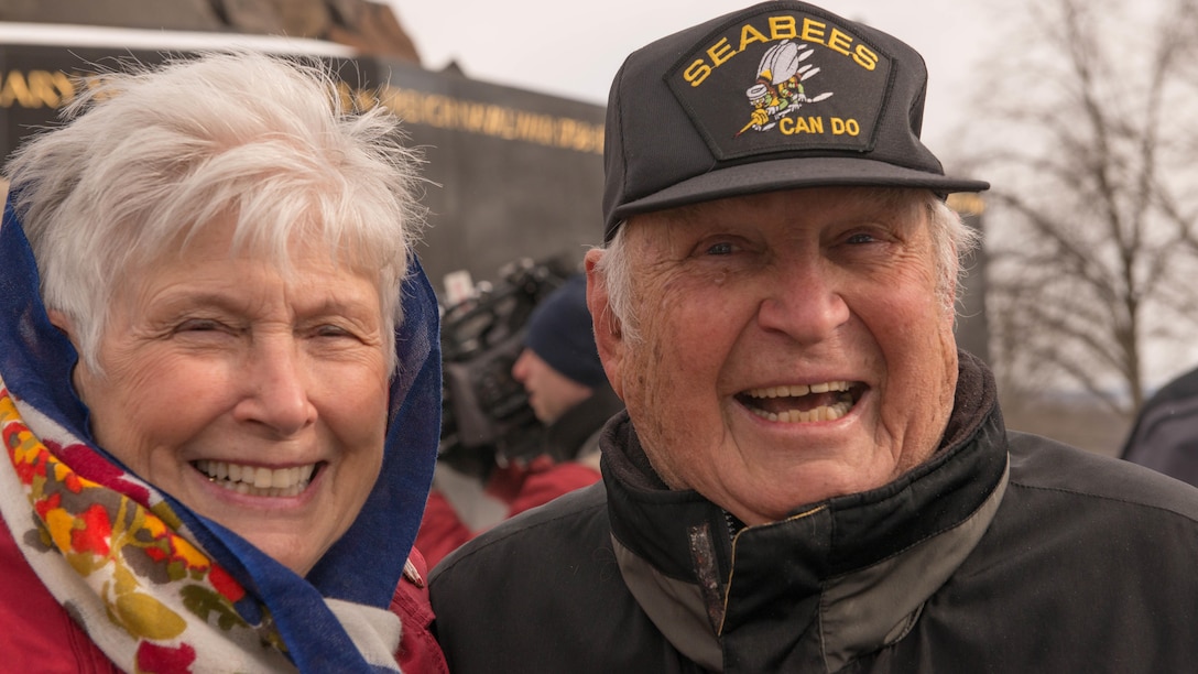 Battle of Iwo Jima veteran and wife speak with each other after the Iwo Jima Wreath Laying Ceremony at the Marine Corps War Memorial in Arlington, Va. on Feb. 19, 2015. The wreath laying recognized the 70th anniversary of the battle and the veterans' sacrifice.