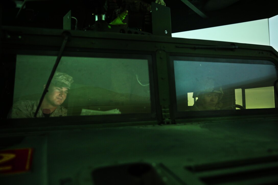 Marines of Company C, Marine Wing Support Squadron 371, utilize the Combat Convoy Simulator at Camp Wilson, Feb. 11, 2015. The Marines were able to stand post and act as a Quick Reaction Force in a simulated environment to help prepare themselves for their upcoming deployment. (Official Marine Corps photo by Lance Cpl. Thomas Mudd/ Released)