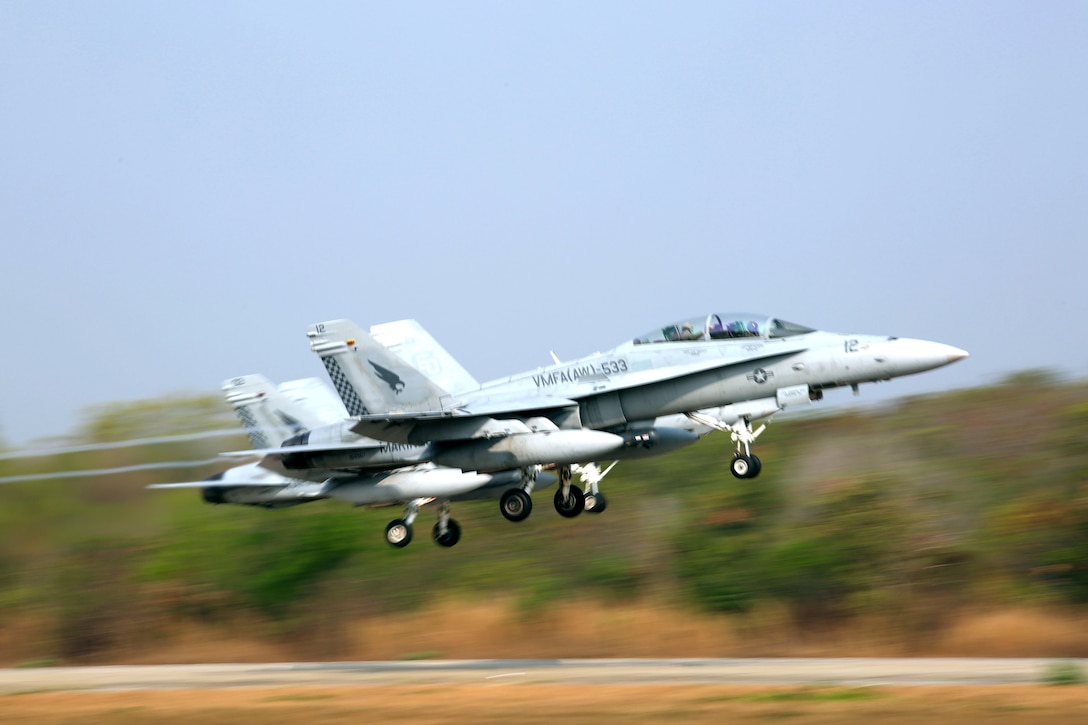 Two F/A-18 Hornets take off for flight during combined training with the Royal Thai Air Force, Feb. 16. U.S. Marines attached to Marine Aircraft Group 12, 1st Marine Aircraft Wing, III Marine Expeditionary Force, and the Royal Thai Air Force train together to maintain readiness and interoperability in support of peace and security in the region as part of Exercise Cobra Gold 2015. For more information on exercise Cobra Gold, please visit the official Facebook page at http://www.facebook.com/ExerciseCobraGold.  