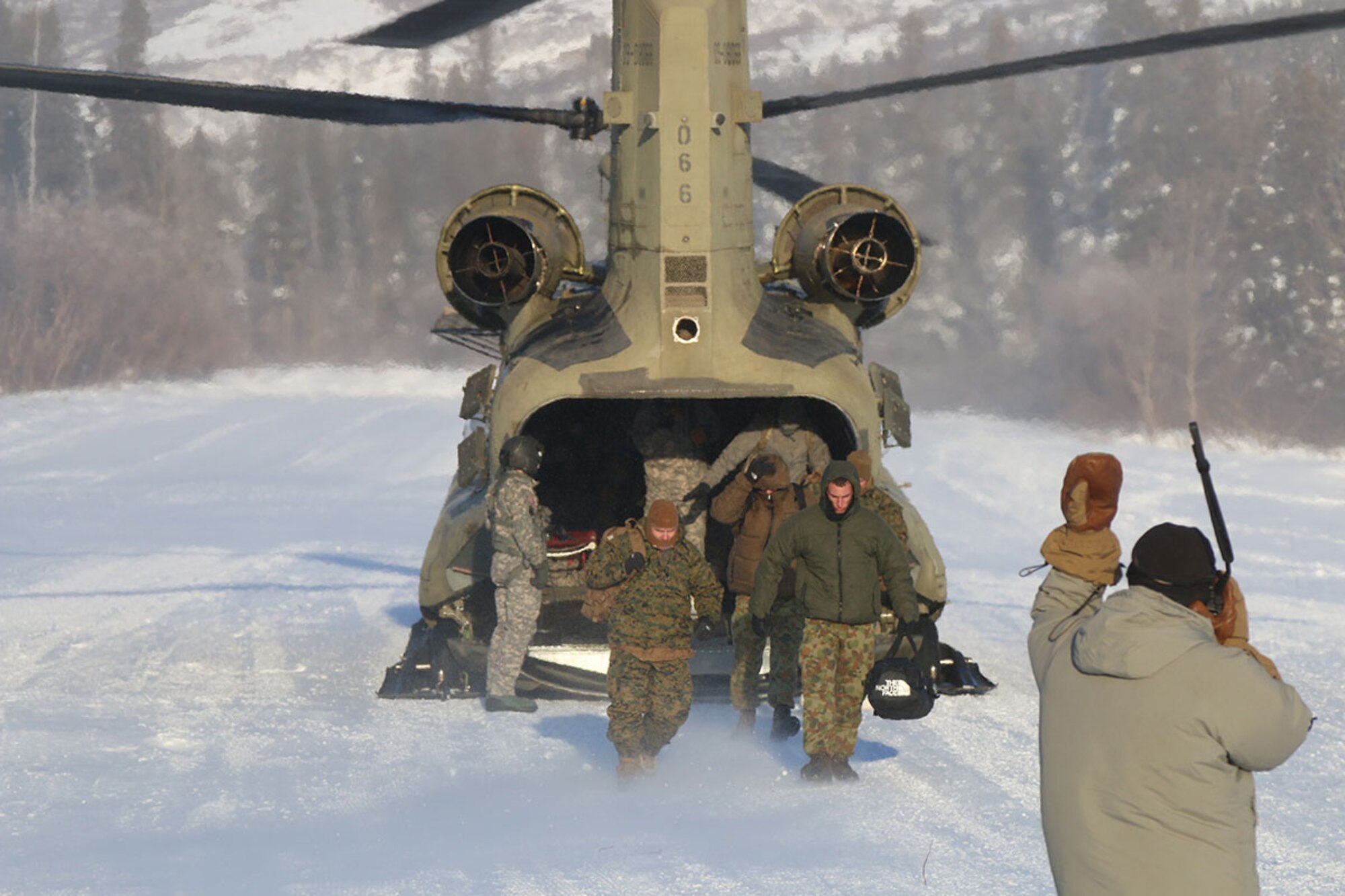 Service members from around the world arrive at the Northern Warfare Training Center Feb. 9. (U.S. Army photos/John Pennell)