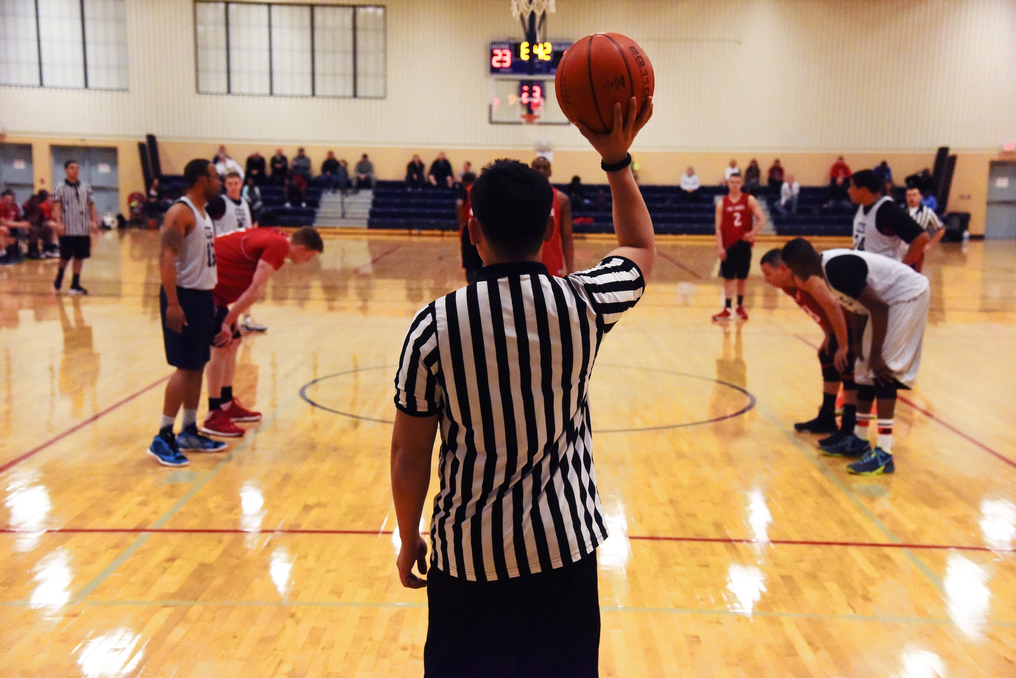 Competitors line up as a member of the 741st Missile Security Forces Squadron basketball team readies himself to attempt a free-throw shot during the 2015 Intramural Basketball Championship Game at Malmstrom Air Force Base’s Fitness Center Feb. 18. This year, more than 1,000 Team Malmstrom members have participated in intramural sports. (U.S. Air Force Photo/Airman 1st Class Collin Schmidt)