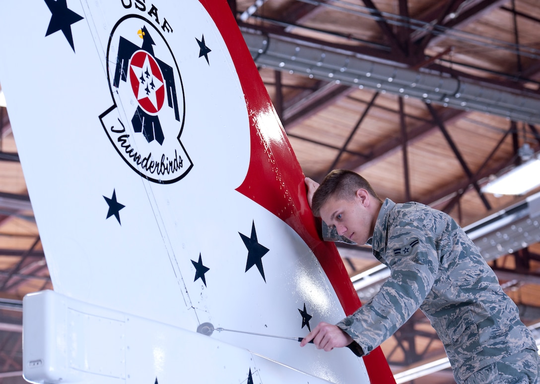 Airman 1st Class Justin Kesler, 362nd Training Squadron Aerospace Maintenance Course student, performs a maintenance inspection on a Thunderbird F-16 Fighting Falcon trainer Feb. 12, 2015 at Sheppard Air Force Base, Texas. Students train to inspect for faults and damages and make necessary repairs before the aircraft is ready to fly.  (U.S. Air Force Photo Danny Webb)


