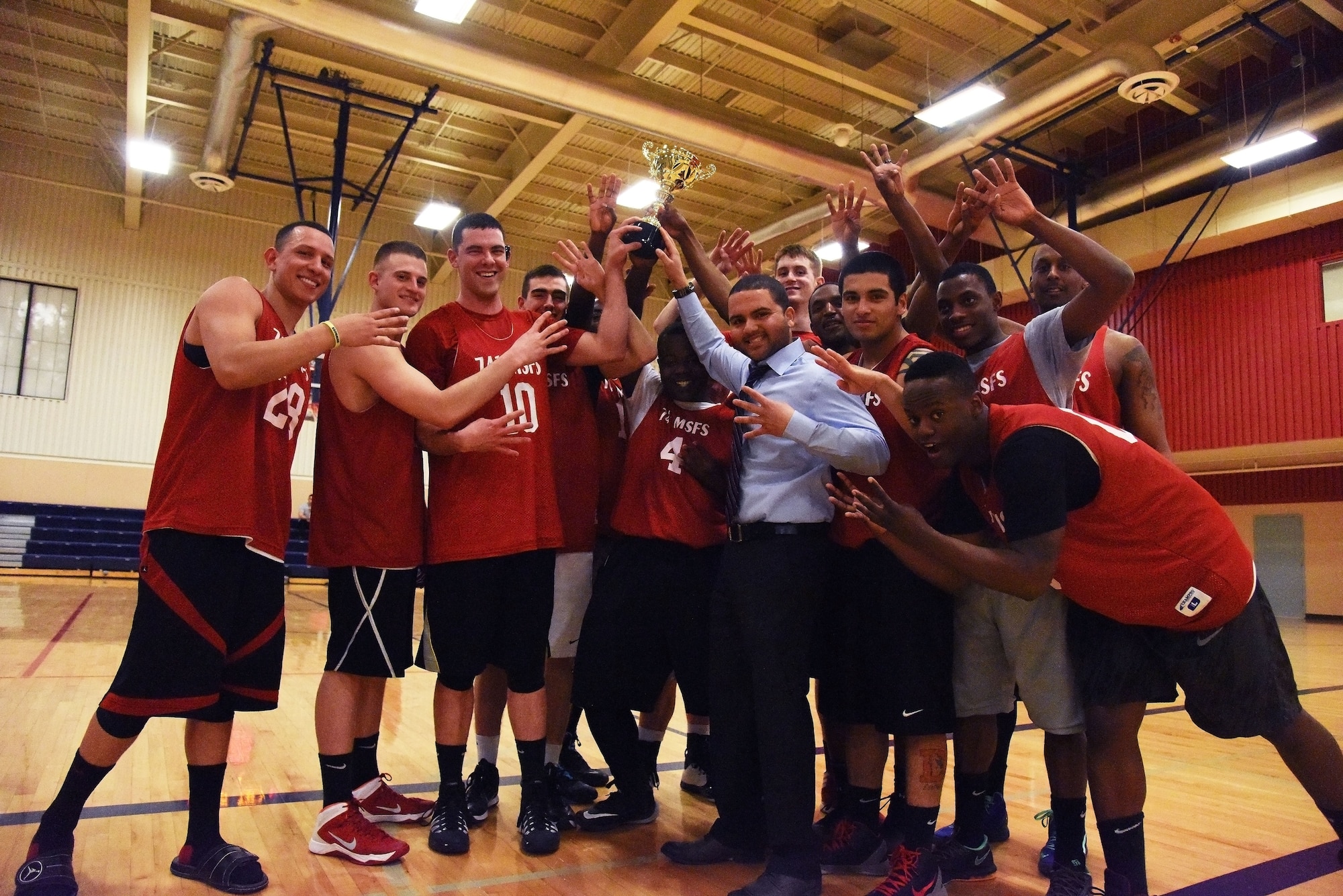 Members of the 741st Missile Security Forces Squadron basketball team pose for a photograph after winning the 2015 Intramural Basketball Championship game at Malmstrom Air Force Base’s Fitness Center Feb. 18. The 741st MSFS basketball team won against the 341st Civil Engineer Squadron with a final score of 72-57. (U.S. Air Force Photo/Airman 1st Class Collin Schmidt) 