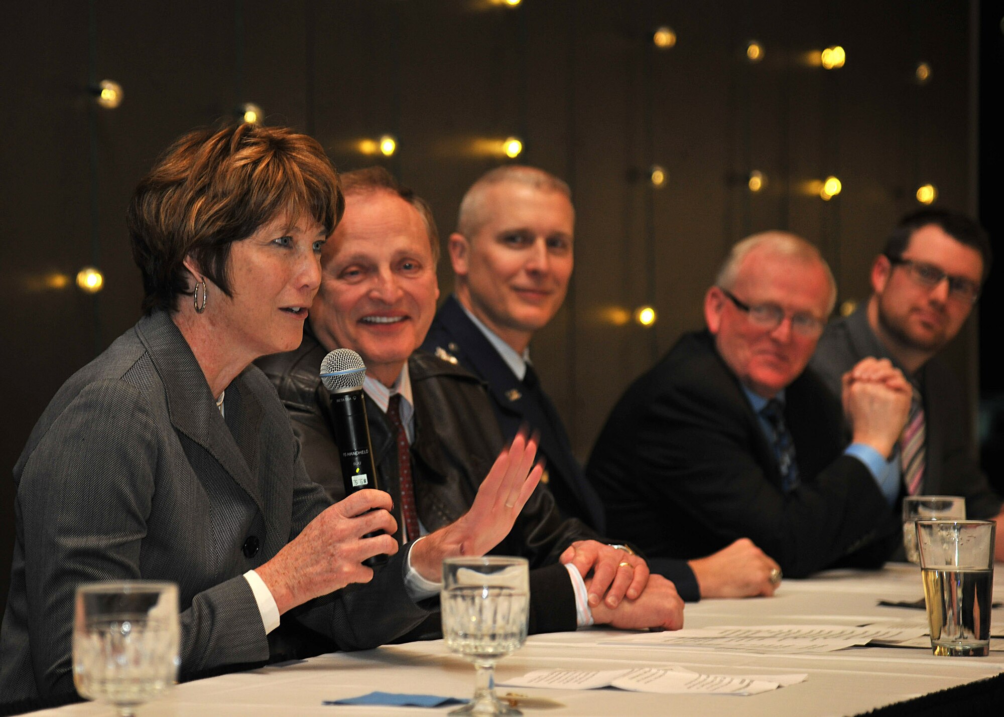 Kathleen Ferguson, Principal Deputy Assistant Secretary of the Air Force for installations, environment and energy, speaks about the value between the county and Grand Forks Air Force Base working hand in hand and showing what other military installations and defense communities can do to operate in difficult fiscal environments on Feb. 17, 2015 at the Gorecki Alumni Center, N.D. Aproximatley 70 attendees witnessed the signing of the Community Partnerships Initiative document. (U.S. Air Force photo/Senior Airman Xavier Navarro)