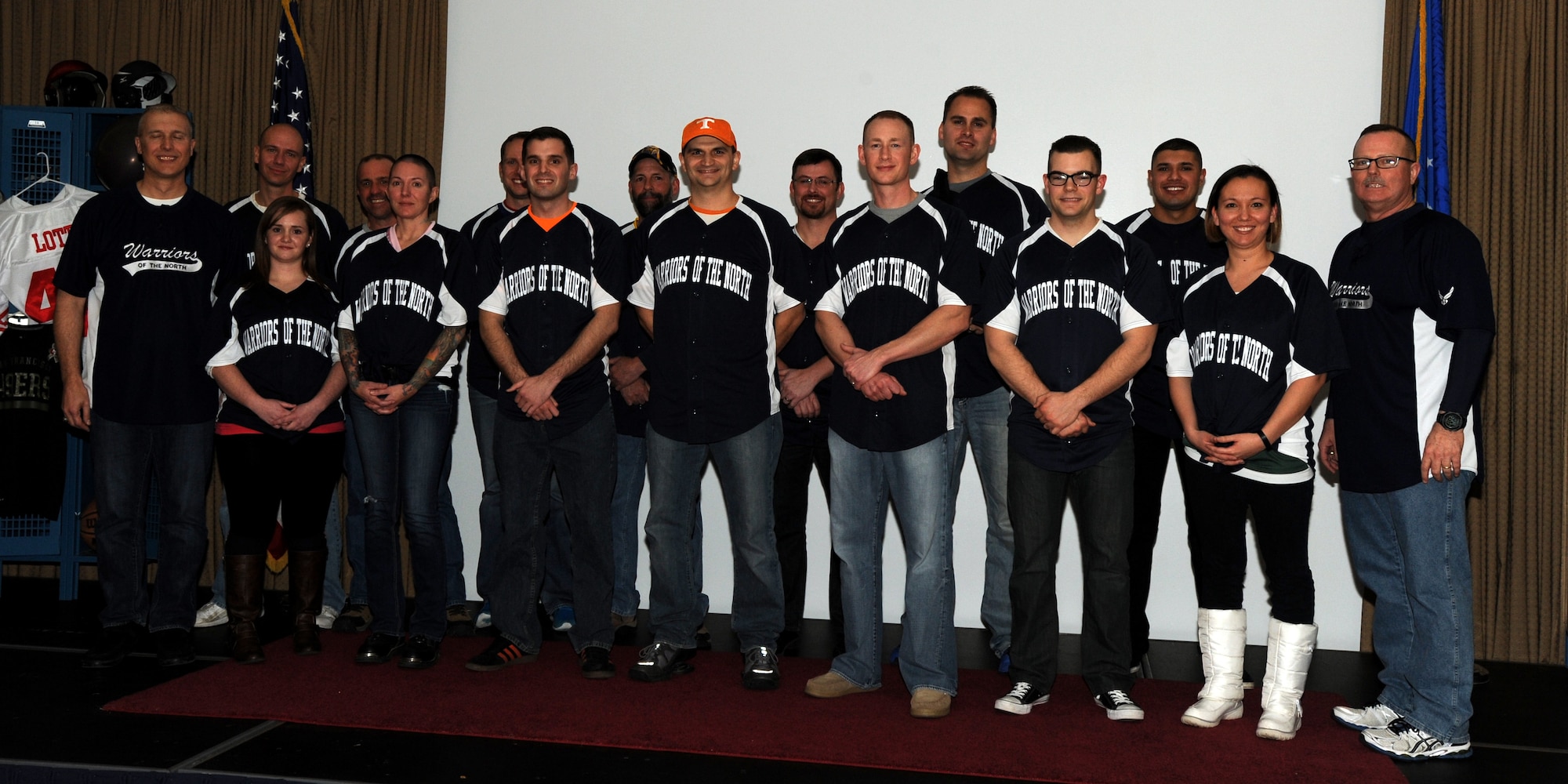 Annual Award winners gather on the stage at the Northern Lights Club stage on Feb. 6, 2015 at Grand Forks Air Force Base. The event kept the new tradition established last year with its sports theme. (U.S. Air Force photo/Staff Sgt. Susan L. Davis)