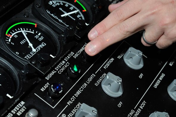 Staff Sgt. Michael Weidman, 92nd Operations Support Squadron instructor boom operator, points to the contact indicator Feb. 17, 2015, at Fairchild Air Force Base, Wash. The indicator tells when the boom has made proper contact with the aircraft that it is refueling. (U.S. Air Force photo/Airman 1st Class Nicolo J. Daniello)