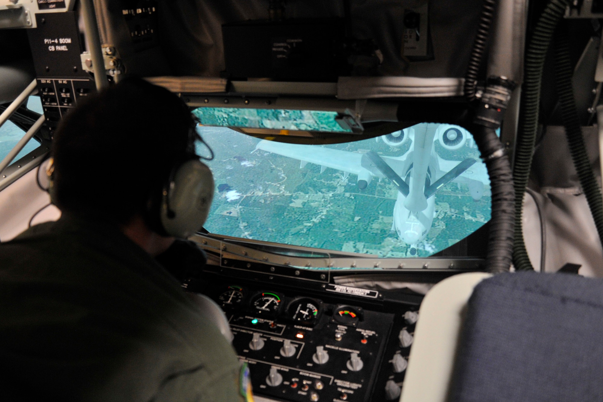 Staff Sgt. Michael Weidman, 92nd Operations Support Squadron instructor boom operator, operates the boom simulator Feb. 17, 2015, at Fairchild Air Force Base, Wash. This training gives boom operators the opportunity to practice emergency procedures without risking damage to the aircraft. (U.S. Air Force photo/Airman 1st Class Nicolo J. Daniello) 