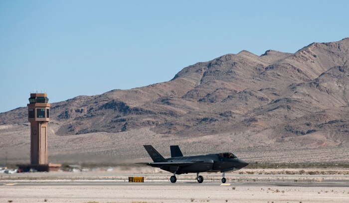 The second F-35 Lightning II assigned to the U.S. Air Force Weapons School lands at Nellis Air Force Base, Nev., Feb. 18, 2015. The integration of the F-35 into the syllabus will better prepare Weapons School students for future conflicts, as well as increase the effectiveness of other combat aircraft. (U.S. Air Force photo by Senior Airman Thomas Spangler)