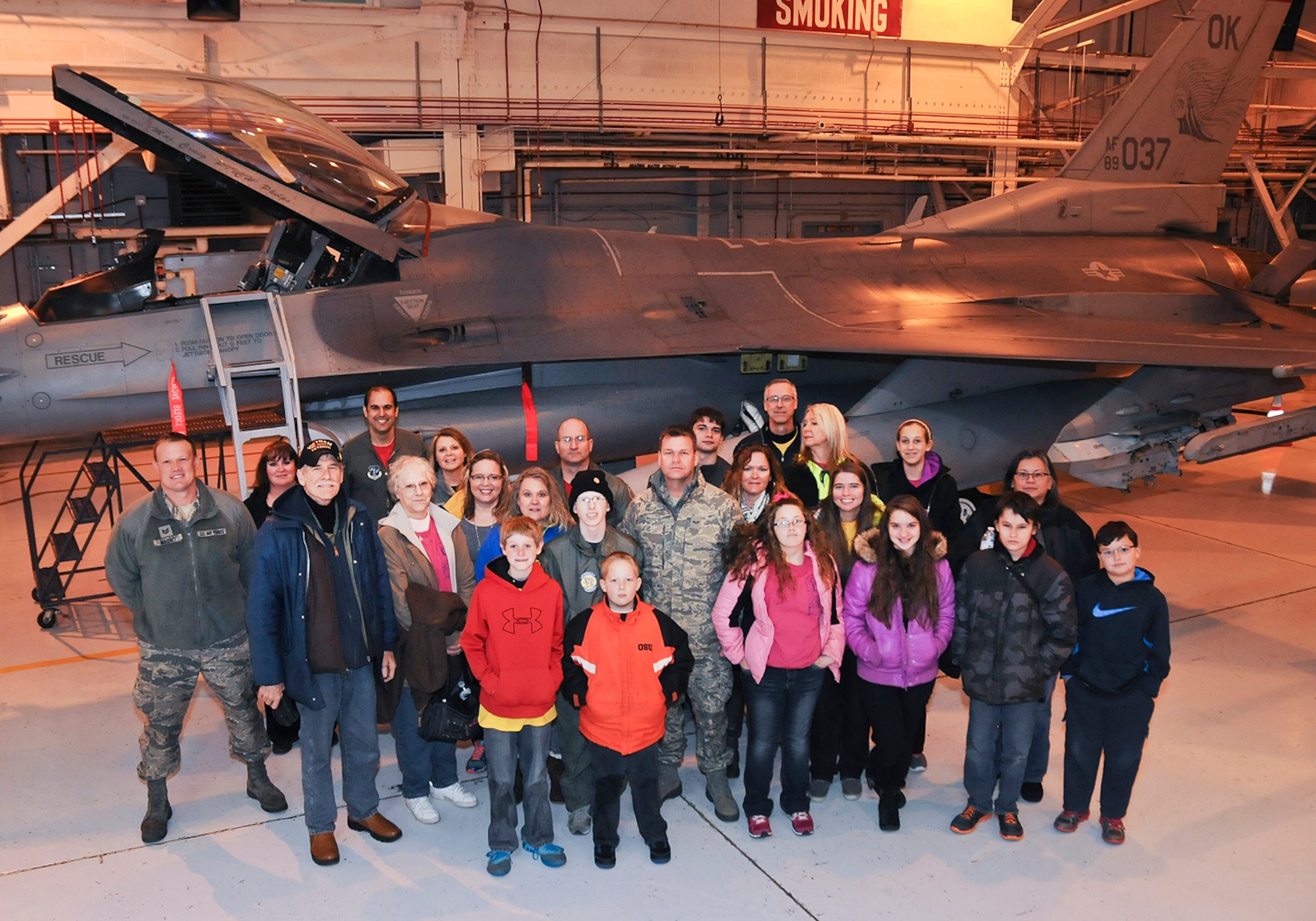 Josh Payton, 138th Fighter Wing's "pilot for a day" stand with family and friends during his visit as an honored guest Feb. 19, 2015, at the Tulsa Air National Guard base, Tulsa, Okla.  The pilot for a day program is intended to recognize and honor children with potentially life threatening illnesses and started at the 138th in May 2012, and has hosted seven children since it began.  (U.S. National Guard photo by Senior Master Sgt.  Preston L. Chasteen/Released)