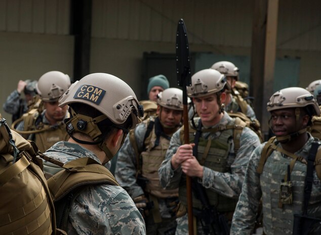 Maj. David Faggard, 1st Combat Camera Squadron commander, addresses his Airmen at Joint Base Charleston, S.C., Jan. 29, 2015, after completing a 2.2 mile ruck in preparation for their annual validation exercise which evaluates their ability to survive and operate in an austere environment. This ruck was dedicated to former 1 CTCS commander, Col. Aaron Burgstein, who passed away Jan. 27, 2015. Burgstein commanded the squadron from July 2009 to July 2012. (U.S. Air Force photo by Senior Airman Marianique Santos/Released)
