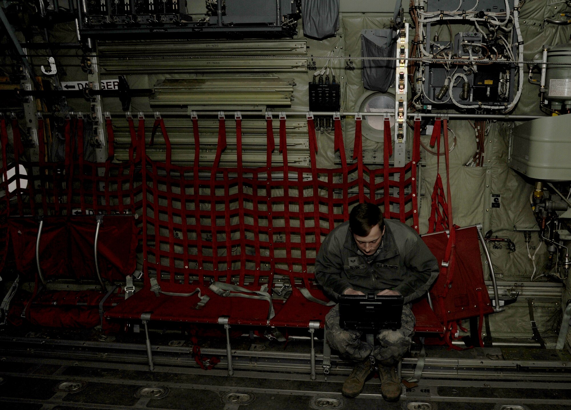 Senior Airman Jonathan Allen, a 19th Aircraft Maintenance Squadron communication countermeasures navigations systems journeyman, conducts research on his laptop Feb. 4, 2015, at Little Rock Air Force Base, Ark. Maintenance Airmen utilize their laptops to refer to diagrams to perform repairs. (U.S. Air Force photo by Airman 1st Class Mercedes Muro) 