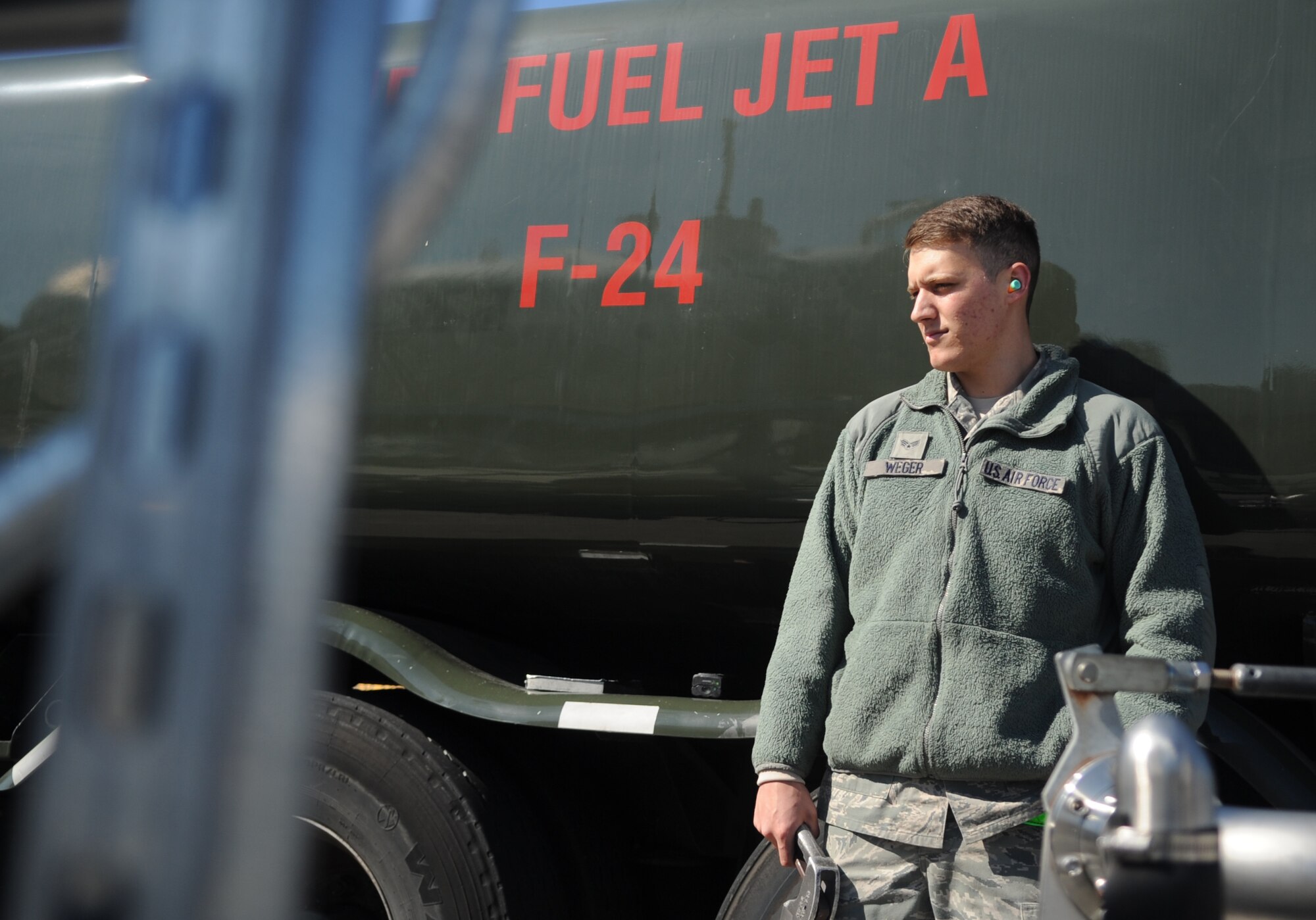 Senior Airman Mitchell Weger, 4th Logistics Readiness Squadron fuels distribution operator, refills a fuel truck after completing refueling runs at Seymour Johnson Air Force Base, North Carolina, Feb. 11, 2015. Each tank truck holds approximately 6,000 gallons of fuel.  (U.S. Air Force photo/Senior Airman Ashley J. Thum)