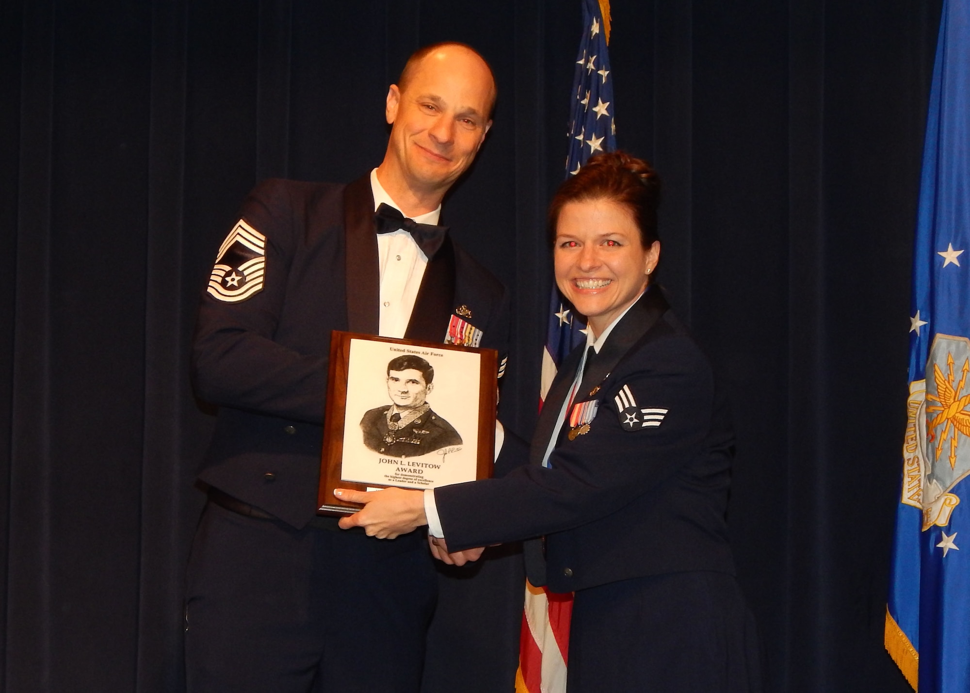 Senior Airman Melinda Charlton, 944th Force Support Squadron personnel apprentice, receives the John L. Levitow award Feb 12 during an Airman Leadership School graduation at Luke Air Force Base Ariz. (U.S. Air Force photo taken by Senior Airman Grace Lee)