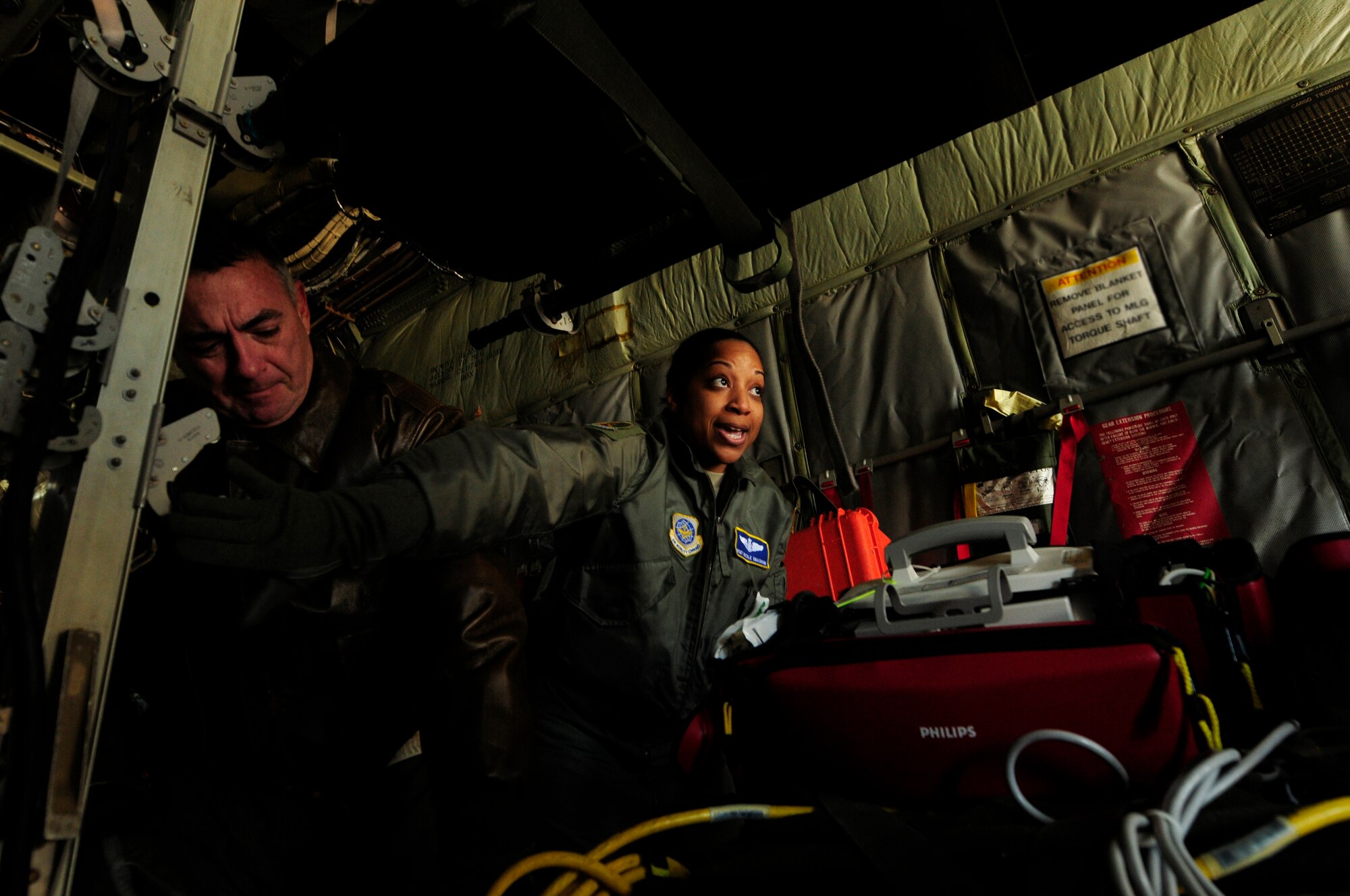 U.S. Air Force Master Sgt. Nicole Smashum, 156th Aeromedical Evacuation Squadron, directs the placement of litters while loading a C-130 Hercules aircraft as part of her chief medical technician duties during an aeromedical training mission at the North Carolina Air National Guard Base, Charlotte Douglas Intl. Airport, Jan. 9, 2015. The training mission scenario is to transfer patients from Landstuhl Medical Center, Germany, to Malcolm Grove Medical Center, Md. (U.S. Air National Guard photo by Staff Sgt. Julianne M. Showalter, 145th Public Affairs/Released)