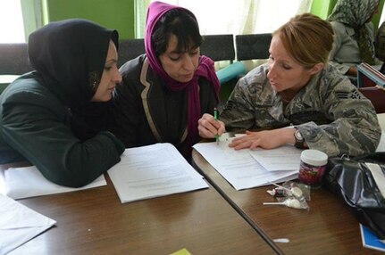 Tech. Sgt. Kristina Decot takes time out of her schedule to mentor and teach English to local Afghanistan. (Courtesy photo/Tech.Sgt. Kristina Decot)