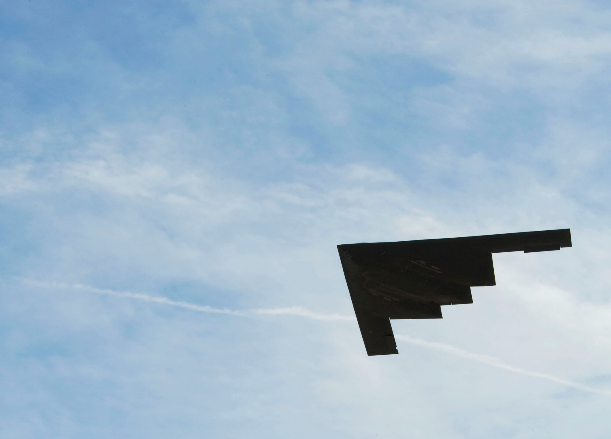 A B-2 Spirit, from Whiteman Air Force Base, Mo., takes off during Red Flag 15-1 at Nellis AFB, Nev., Feb. 5, 2015. The B-2’s signature shape and advanced skin lends to its stealth ability and enables it to evade enemy radars. (U.S. Air Force photo by Staff Sgt. Victoria Sneed)