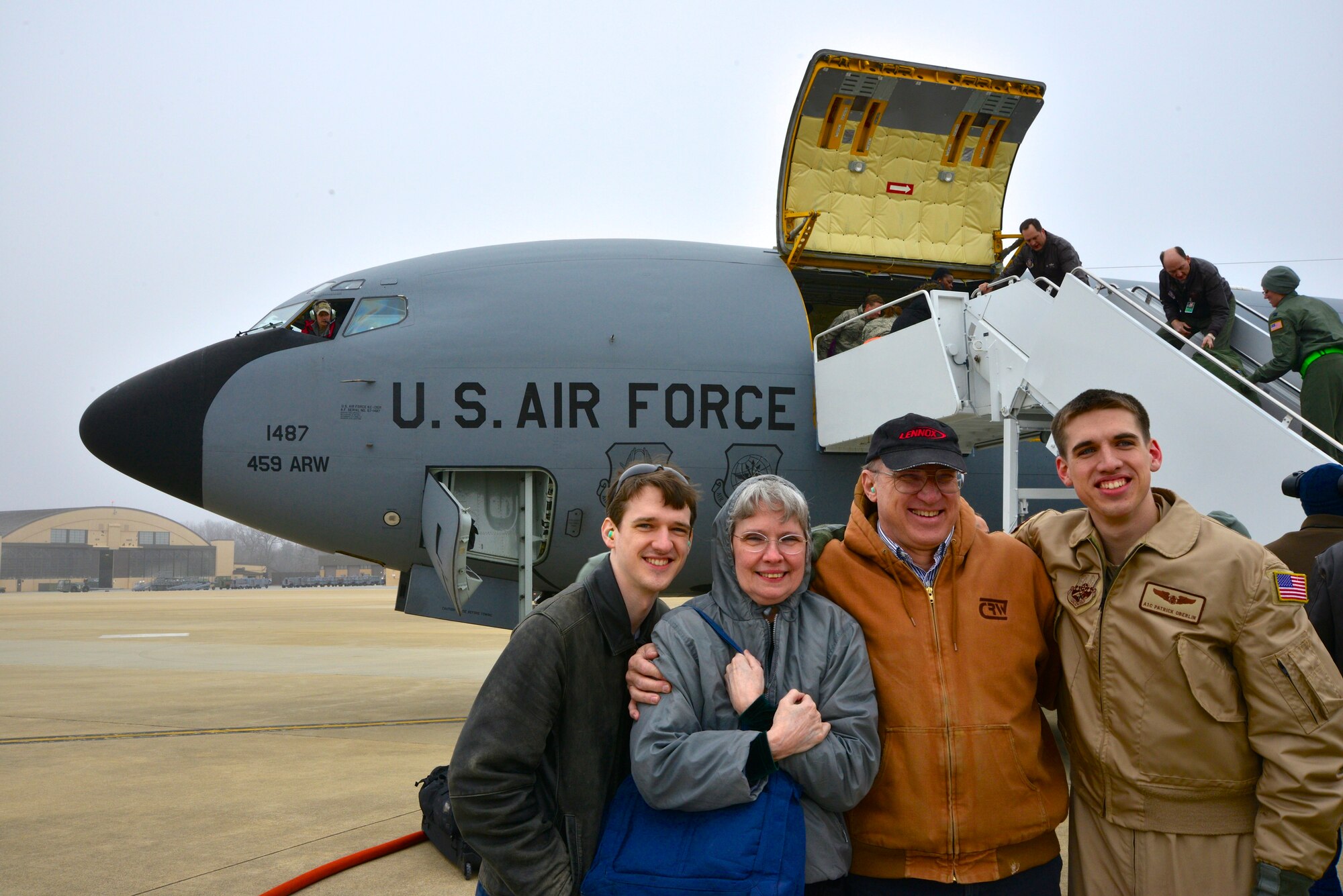 Airman 1st Class Patrick Oberlin, 756th ARS boom operator, greets his family after returning from a deployment to Southwest Asia. (U.S. Air Force Photo / Tech. Sgt. Erica Knight)