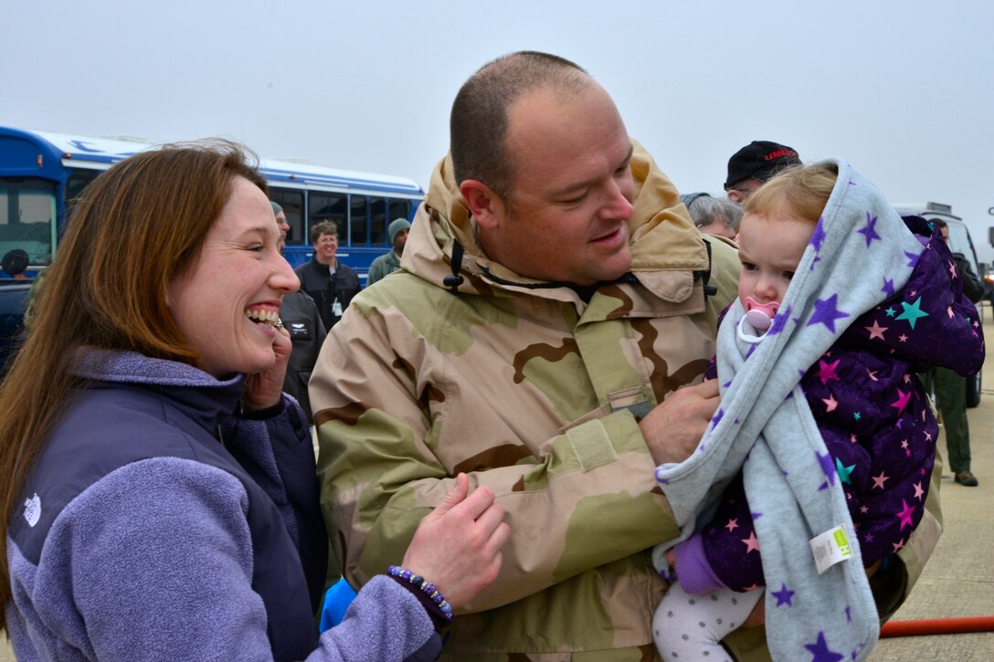 KC-135 Stratotanker aircraft commander/pilot Maj. Stephen Akins, 756th ARS is greeted by his family after returning from his deployment to Southwest Asia. (U.S. Air Force Photo / Tech. Sgt. Erica Knight)