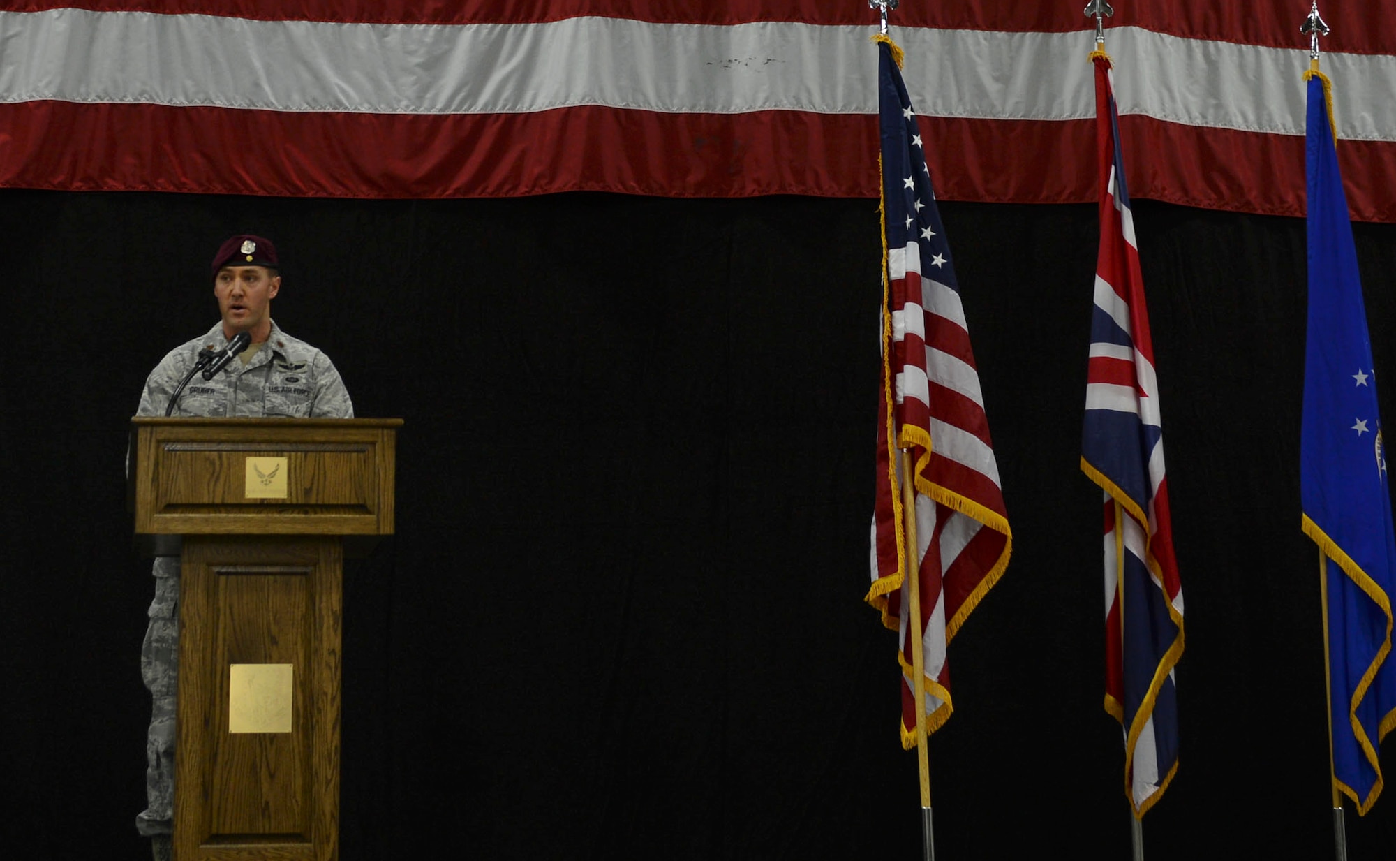 Maj. Patrick Gruber, 57th Rescue Squadron commander, addresses the crowd during the 57th RQS activation ceremony at Royal Air Force Lakenheath, England, Feb. 18, 2015. The 57th RQS consists of 35 pararescuemen and equipment personnel already stationed at RAF Lakenheath. (U.S. Air Force photo by Airman 1st Class Dawn M. Weber/Released)