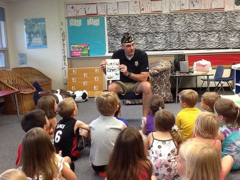 Senior Master Sgt. Craig A. Mortvedt teaches the Pledge of Allegiance to students at Hearts and Hands Preschool in Mount Horeb, Wis. Submitted photo