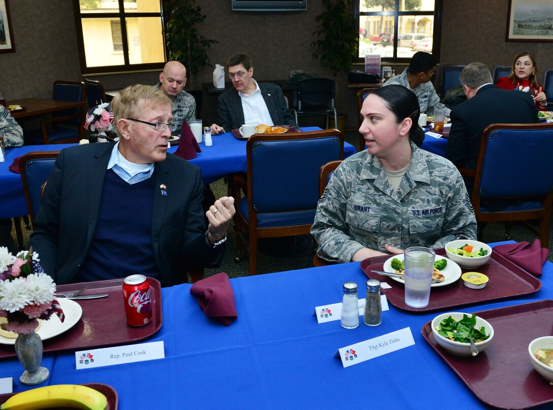 U.S. Congressman Paul Cook, California 8th District, speaks with Tech. Sgt. Lucinda Grant, 39th Medical Operations Squadron ambulance services NCO in charge, during a congressional delegate’s luncheon Feb. 18, 2015, at Incirlik Air Base, Turkey. The congressional representatives spoke with nearly 20 Airmen from their home states. (U.S. Air Force photo by Senior Airman Michael Battles)