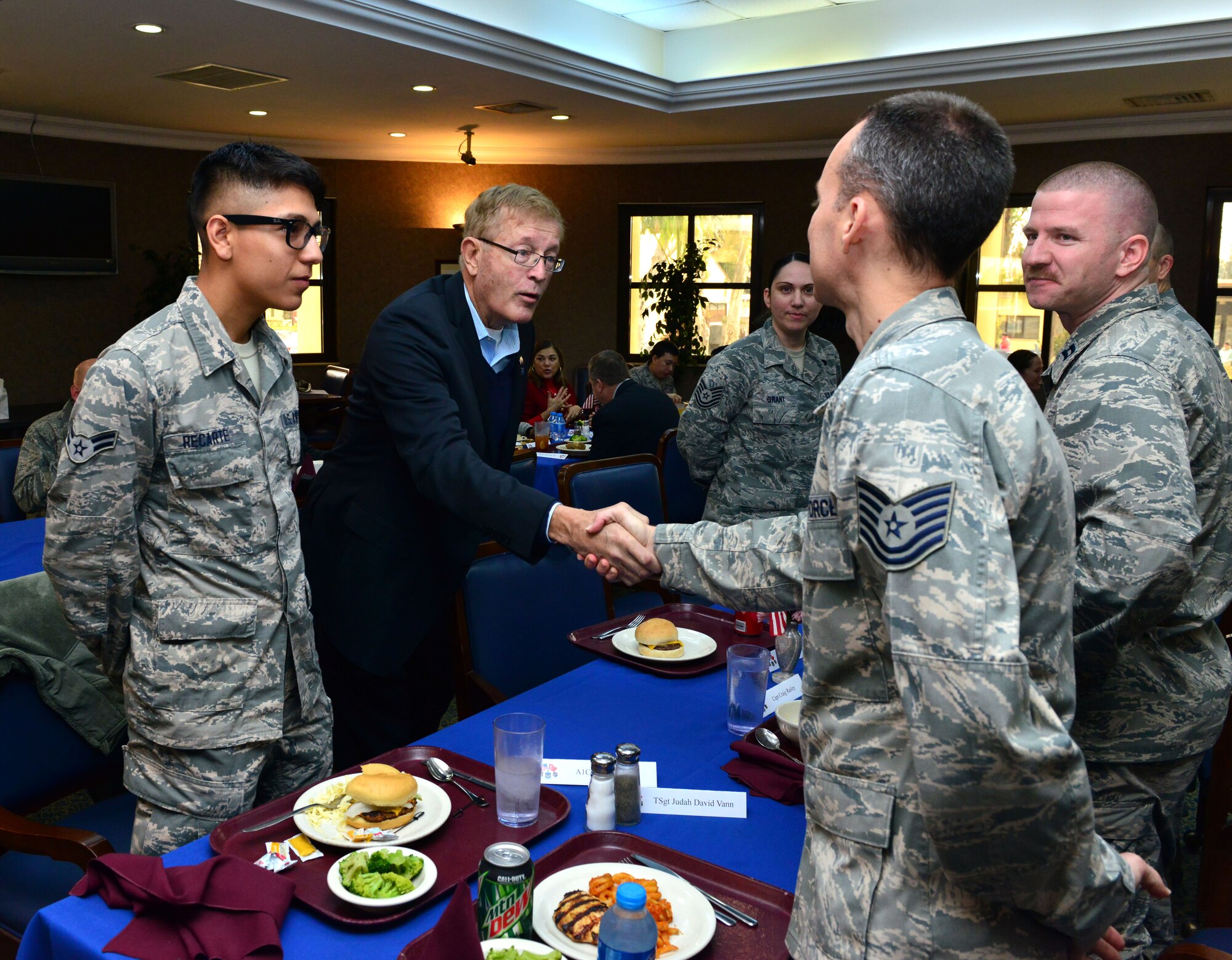 U.S. Congressman Paul Cook, California 8th District, greets service members during a congressional delegate’s luncheon Feb. 18, 2015, at Incirlik Air Base, Turkey. During the luncheon Airmen got to speak to their home state congress representatives about where they are from and life overseas in the military. (U.S. Air Force photo by Senior Airman Michael Battles)