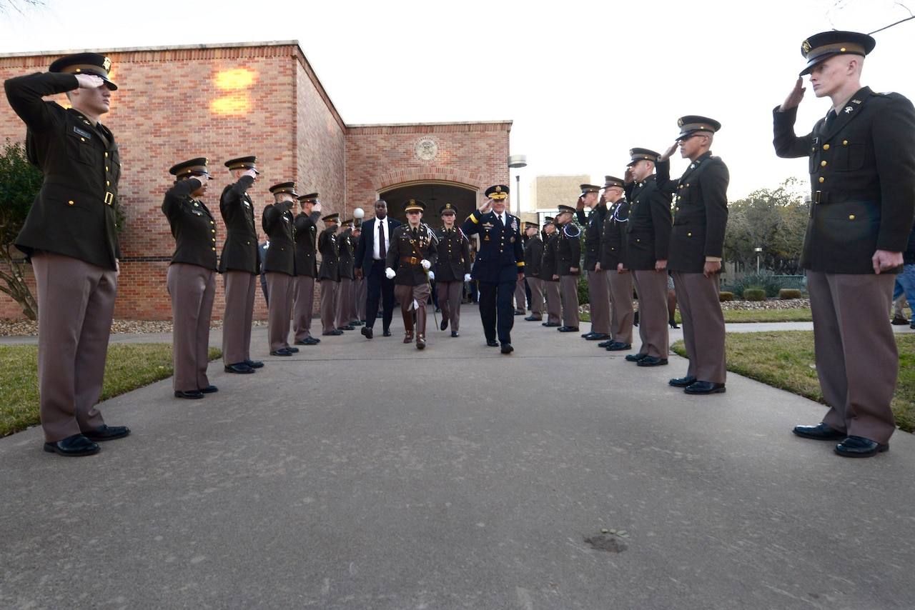 Members of the Corps of Cadets at Texas A&M University salute Army Gen. Martin E. Dempsey, chairman of the Joint Chiefs of Staff, upon his arrival in College Station, Texas, Feb. 18, 2015. Dempsey visited the university to meet with cadets and talk with them on a range of topics. DoD photo by D. Myles Cullen