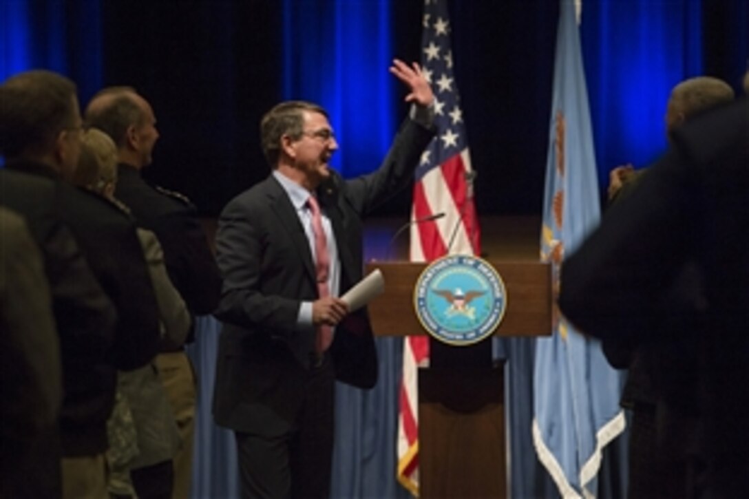 Defense Secretary Ash Carter waves goodbye after hosting an all-call meeting at the Pentagon, Feb. 19, 2015, to inform Defense Department personnel about his priorities as he takes office.
