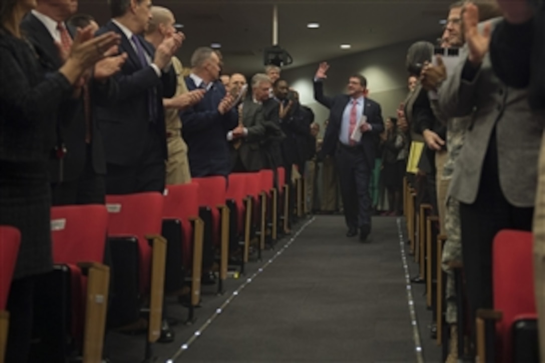 Defense Secretary Ash Carter waves hello before he hosts an all-call meeting at the Pentagon, Feb. 19, 2015, to inform Defense Department personnel about his priorities as he takes office.