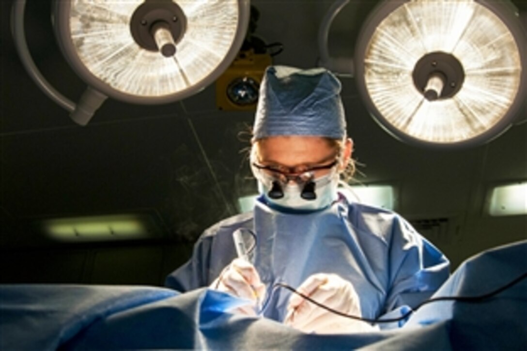 U.S. Navy Lt. Cmdr. Jada Leahy performs surgery on the aircraft carrier USS George H.W. Bush in the Atlantic Ocean, Feb. 16, 2015. The Bush is conducting training exercises in the Atlantic Ocean.