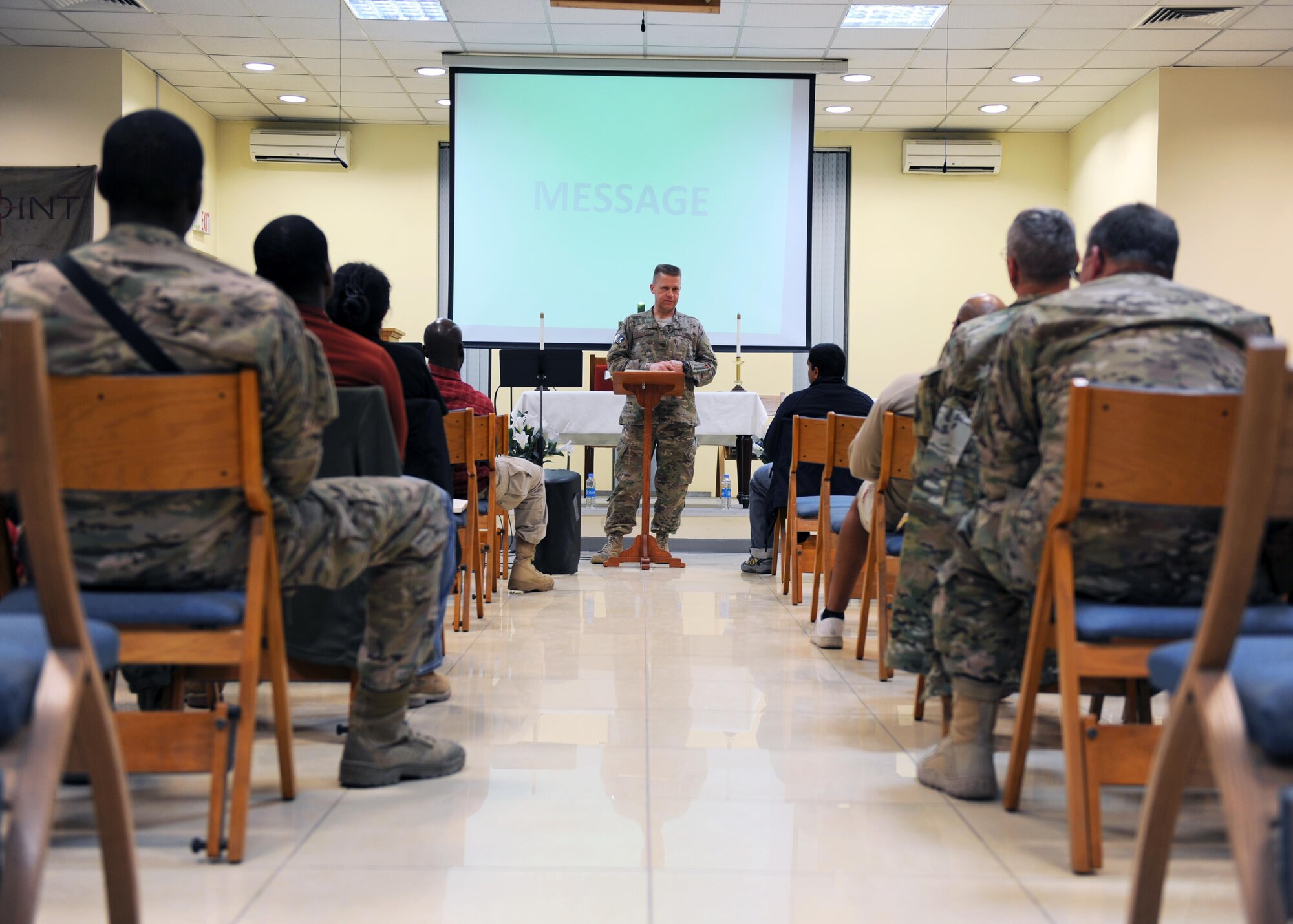U.S. Air Force Maj. William Braswell, 455th Air Expeditionary Wing chaplain, speaks during an evening church service during a Religious Support Team visit Feb. 15, 2015 at Hamid Karzai International Airport in Kabul. Braswell, accompanied by U.S. Air Force Tech. Sgt. Aleric Hebert, 455 AEW chaplain assistant, travels throughout the U.S. Air Force Central Command Area of Responsibility engaging with Airmen and conducting church services to ensure deployed servicemembers are spiritually fit to fight.(U.S. Air Force photo by Staff Sgt. Whitney Amstutz/released)