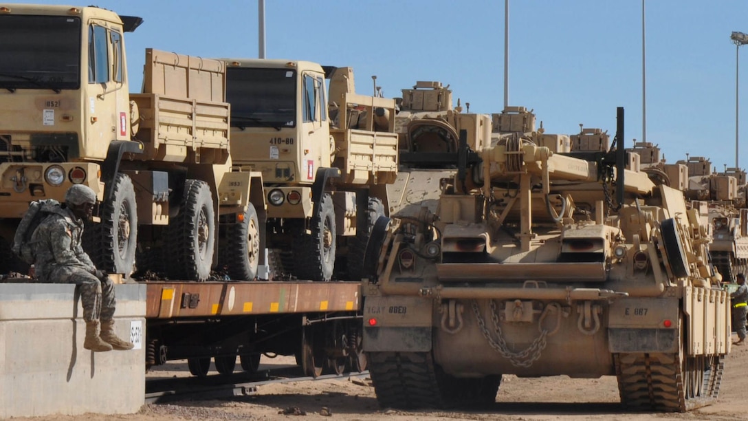 Lance Cpl. Michael Miller and Lance Cpl. Kyle Osborne, Marines with Combat Logistics Battalion 5, Camp Pendleton, Calif., oversee unloading of equipment with solders from 1st Cavalry Division out of Ft. Hood, Texas, as part of their Railway Operations training at the Yermo Annex on Marine Corps Logistics Base Barstow, Calif., Feb. 11. The 80-hour RailOps training is now being offered through Marine Corps Training Information Management System and includes class instruction and hands-on learning