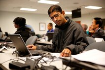 Sundar Sitaraman, a mechanical systems engineer who supports Advanced Amphibious Assault at Program Executive Officer Land Systems, studies the ADAMS software that simulates loads and forces on large equipment. He was in a class with other engineers from Marine Corps Systems Command and PEO LS that learned industry standards to gauge machine performance. (U.S. Marine Corps Photo by Jim Katzaman)
